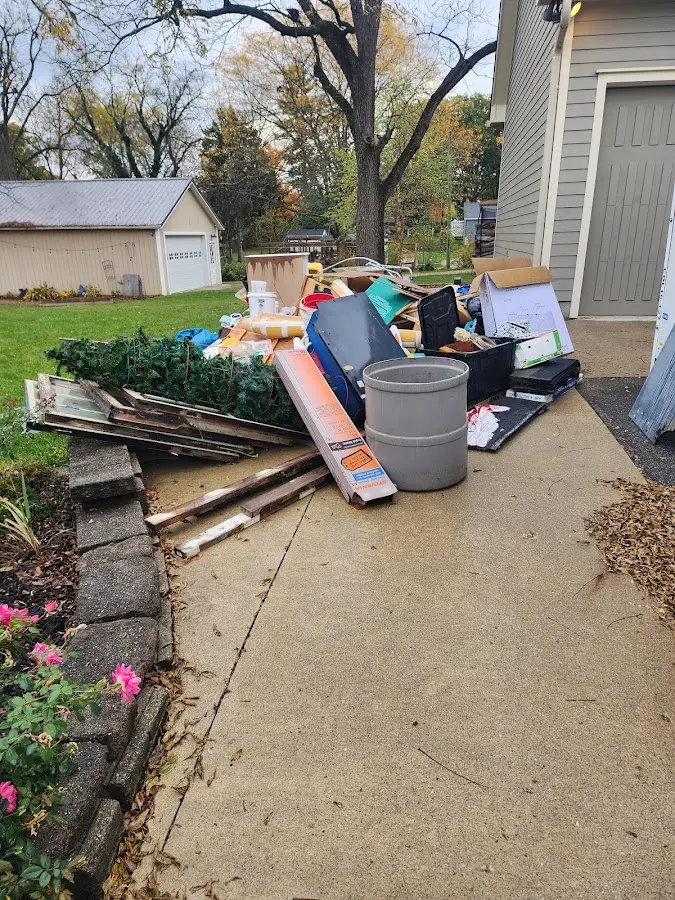 Dumpster being loaded with debris for Commercial Dumpster Rental in Joppatowne
